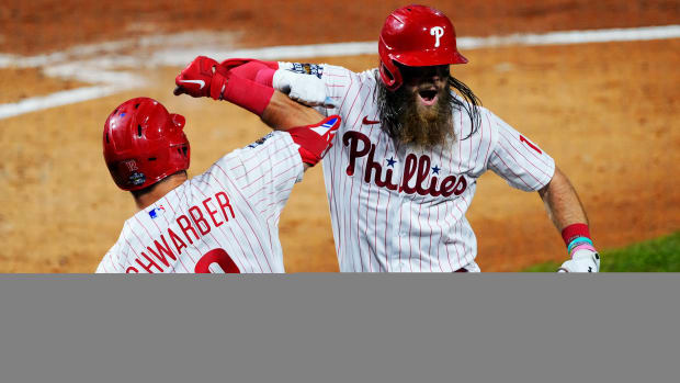 Phillies center fielder Brandon Marsh celebrates with Kyle Schwarber after hitting a home run in the World Series.